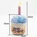 Mini birthday-cake plush dog toy with pastel blue frosting and pink candle, 10 x 22 cm